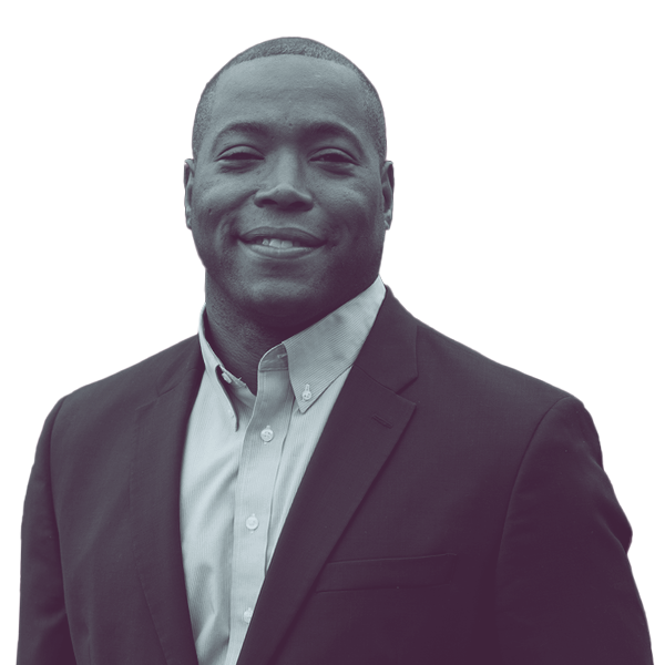 Black and white headshot of Aaron Rouse, Virginia SD-22, smiling and looking directly into the camera.