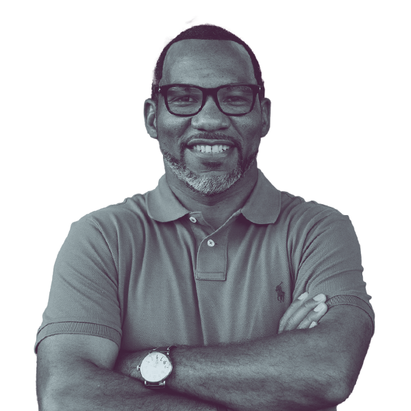 Kelvin May of Louisiana HD-75 smiling with his arms crossed and looking into the camera