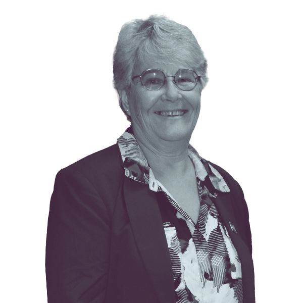 Black and white image of Cathleen Fountain of NH HD-Coos 1 from the waist up, smiling and looking into the camera.