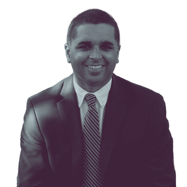 Black and white image of Dante Pittman of North Carolina House District Twenty-Four showing him from the waist smiling and looking into the camera.