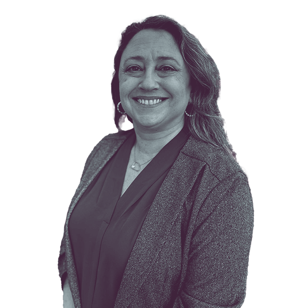 A black and white image of Nicole Sidman of North Carolina House District 105 showing her from the waist smiling and looking into the camera.