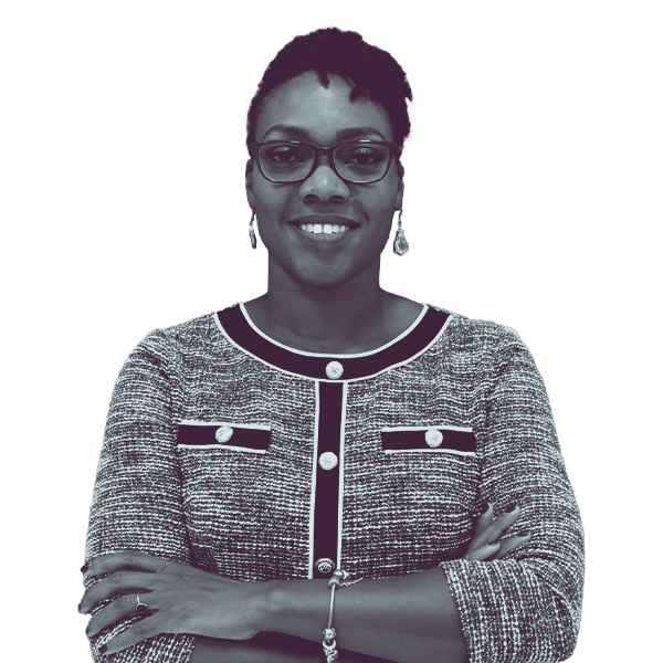 A black and white image of Safiyah Jackson of North Carolina House District Thirty-Seven showing her from the waist smiling and looking into the camera.