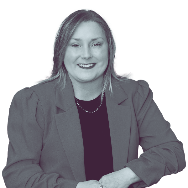 A black and white portrait of Anna Payne of PA HD-142 from the waist up, smiling and looking into the camera.