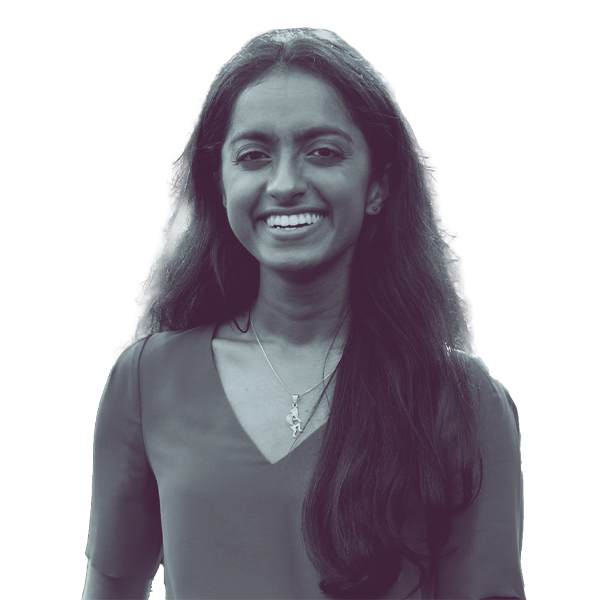 A black and white portrait of Anna Thomas of PA HD-137 from the waist up, smiling and looking into the camera.