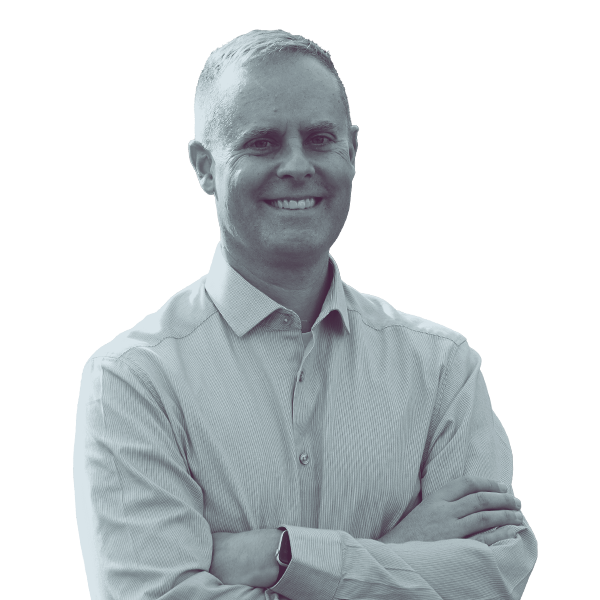 A black and white portrait of Bill Petulla of PA HD-28 from the waist up, smiling and looking into the camera.