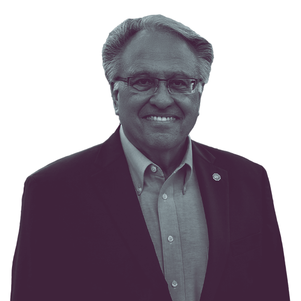 A black and white portrait of Eddie Day Pashinski of PA HD-121 from the waist up, smiling and looking into the camera.