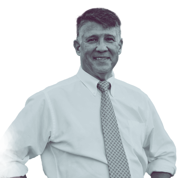 A black and white portrait of Jim Haddock of PA HD-118 from the waist up, smiling and looking into the camera.