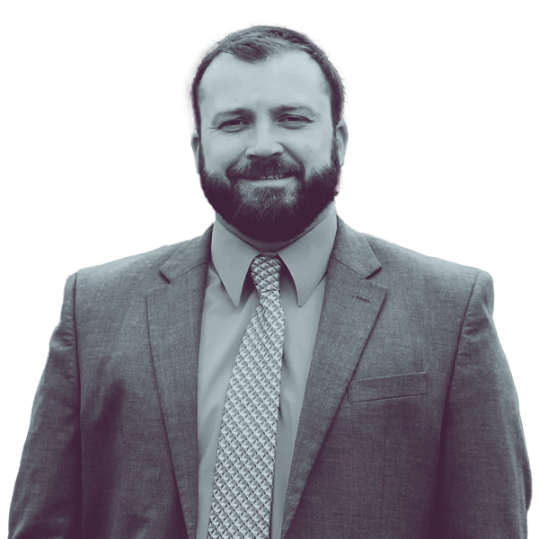 A black and white portrait of John Inglis of PA HD-38 from the waist up, smiling and looking into the camera.