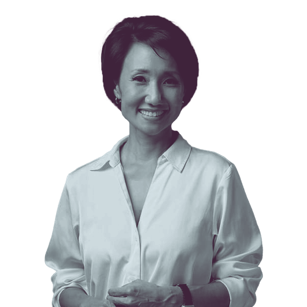 A black and white portrait of Patty Kim of PA SD-15 from the waist up, smiling and looking into the camera.