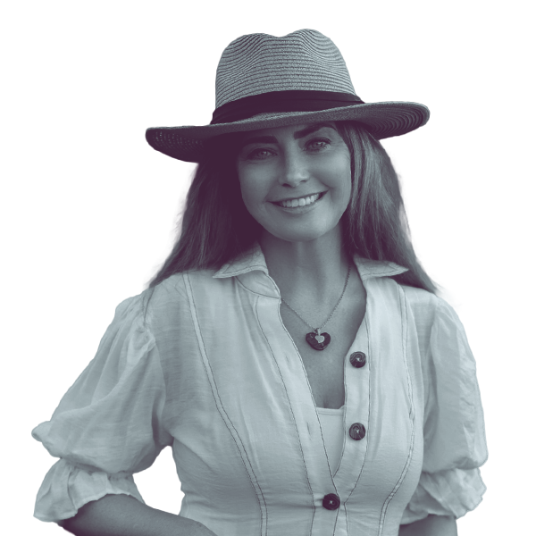 A black and white portrait of Mary Shea of Idaho house district 29a from the waist up, smiling and looking into the camera.