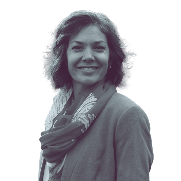 A black and white portrait of Virginia Stapleton of Oregon House District 21 from the waist up, smiling and looking into the camera