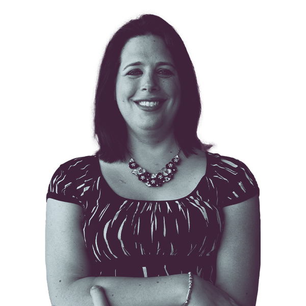 A black and white portrait of Aime Wichtendahl of Iowa House District 80 from the waist up, smiling and looking into the camera.