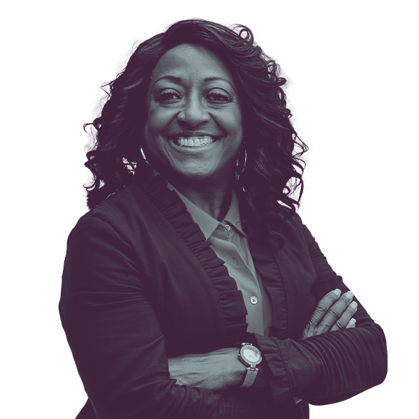 A black and white image of Angie Taylor of Nevada Senate district fifteen from the waist up smiling and looking into the camera.