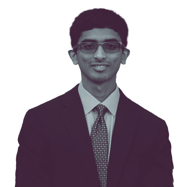 A black and white image of Ashwin Ramaswami of Georgia Senate district forty-eight from the waist up smiling and looking into the camera.