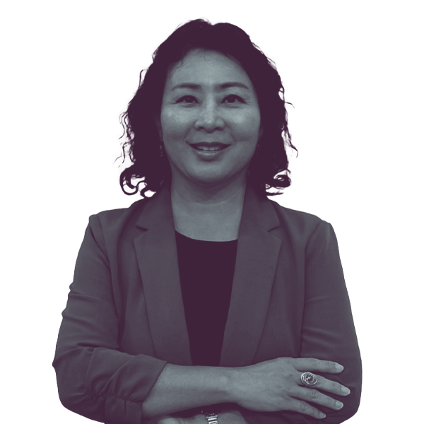 A black and white image of Michelle Kang of Georgia House district ninety-nine from the waist up smiling and looking into the camera.