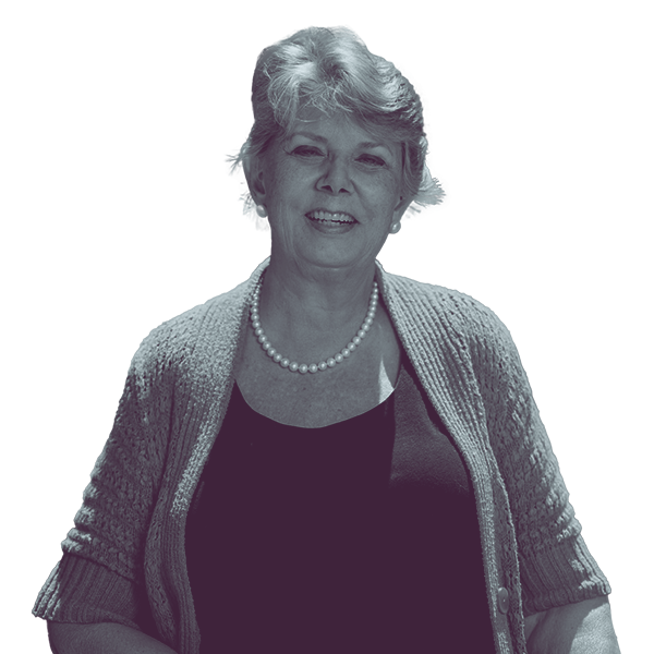 A black and white image of Sharon Winters of Arizona Senate district thirteen from the waist up, smiling and looking into the camera.