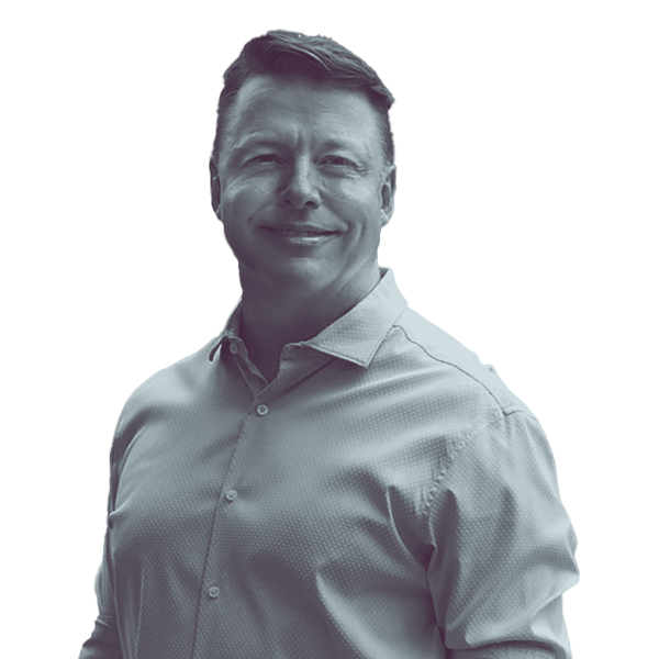 A black and white image of Jeff Pittman of Kansas Senate district five from the waist up, smiling and looking into the camera.