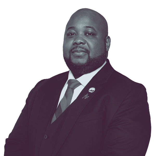 A black and white image of Daniel Mahoney of Michigan House district forty-six from the waist up, smiling and looking into the camera.