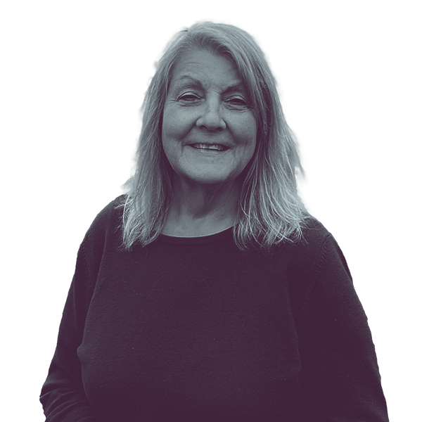 A black and white image of Denize Mentzer of Michigan House district sixty-one from the waist up, smiling and looking into the camera.