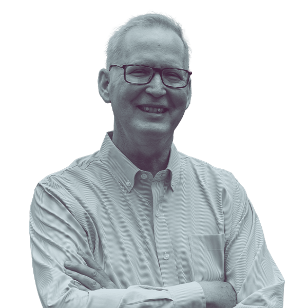 A black and white image of Jim Haadsma of Michigan House district forty-four from the waist up, smiling and looking into the camera.