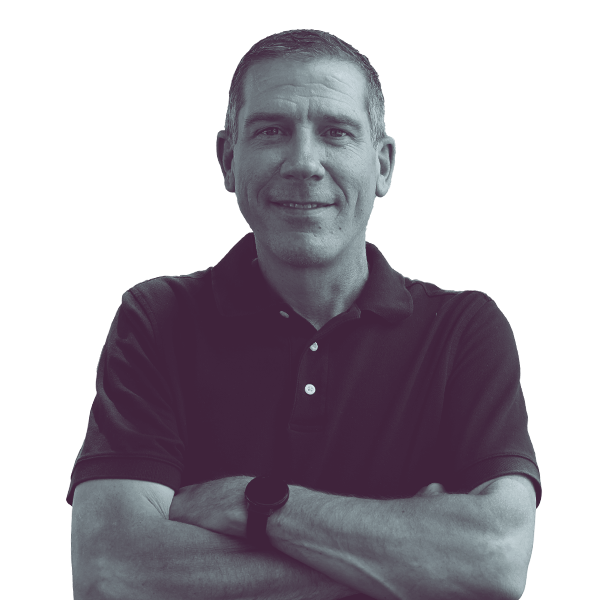 A black and white image of Nate Shannon of Michigan House district fifty-eight from the waist up, smiling and looking into the camera.