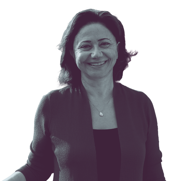 A black and white image of Shadia Martini of Michigan House district fifty-four from the waist up, smiling and looking into the camera.