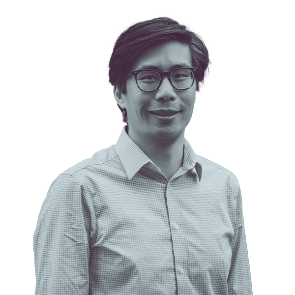 A black and white waist-up portrait of Ben Ming, candidate for New Hampshire Senate District twelve, smiling and looking into the camera.