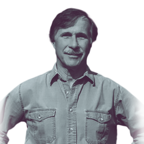 A black and white waist-up portrait of Hal Rafter, candidate for New Hampshire House District Rockingham one, smiling and looking into the camera.