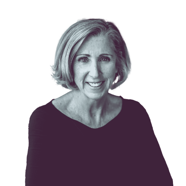 A black and white waist-up portrait of Judy Johnson, candidate for New Hampshire House District Hillsborough twenty nine, smiling and looking into the camera.