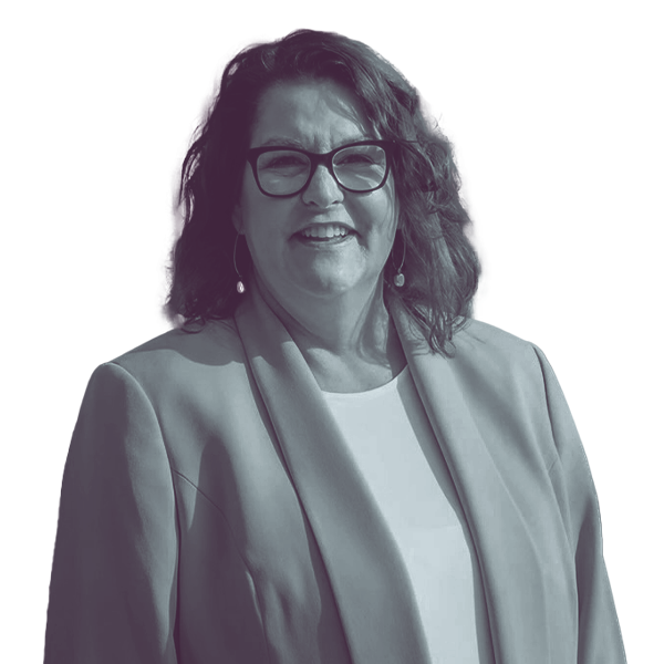 A black and white waist-up portrait of Shannon Chandley, candidate for New Hampshire Senate District eleven, smiling and looking into the camera.