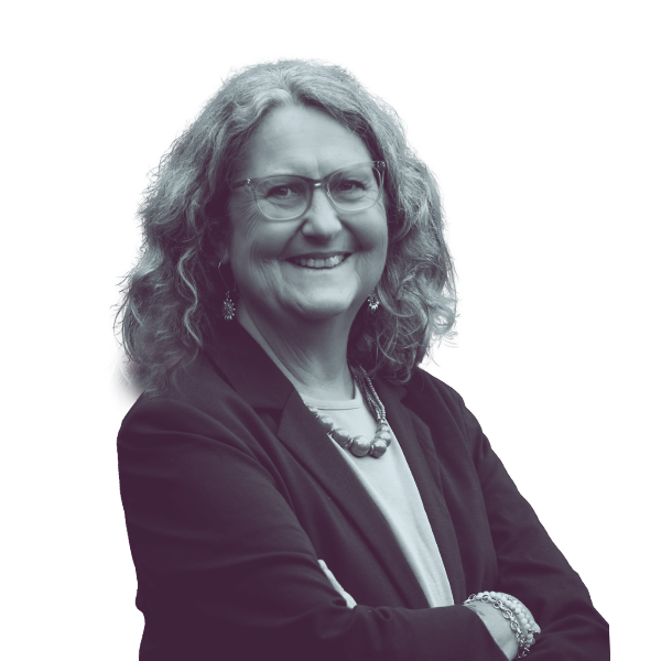 A black and white waist-up portrait of Wendy Thomas, candidate for New Hampshire House District Hillsborough twelve, smiling and looking into the camera.