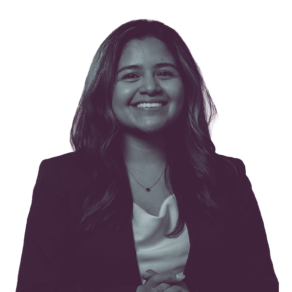 A black and white waist-up portrait of Maria Beltran, candidate for Washington Senate District fourteen, smiling and looking into the camera.