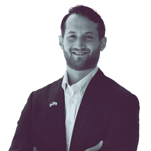 A black and white waist-up portrait of Jay Shooster, candidate for Florida House District ninety one, smiling and looking into the camera.
