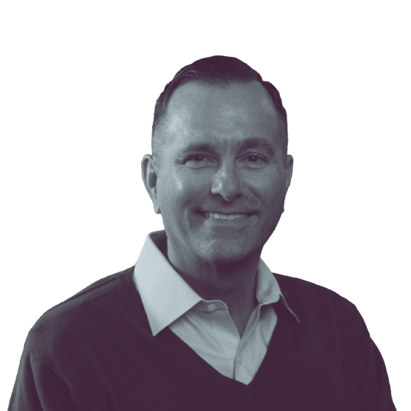 a black and white portrait of Dan Cruce, Democratic candidate for Delaware Senate district one, smiling and looking into the camera.