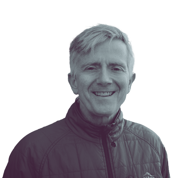 a black and white portrait of Sean Faircloth, Democratic candidate for Maine House district 24, smiling and looking into the camera.