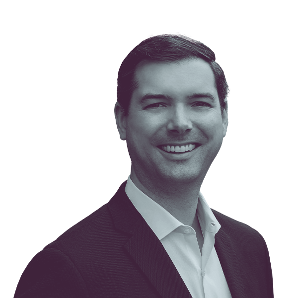 A black and white portrait of Josh Thomas, Democratic candidate for Virginia House District 21, smiling and looking into the camera.