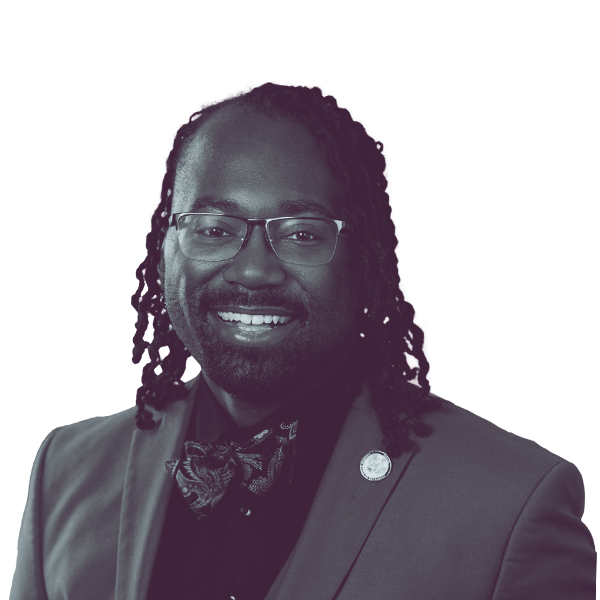 A black and white portrait of Nadarius Clark, Democratic candidate for Virginia House District 84, smiling and looking into the camera.