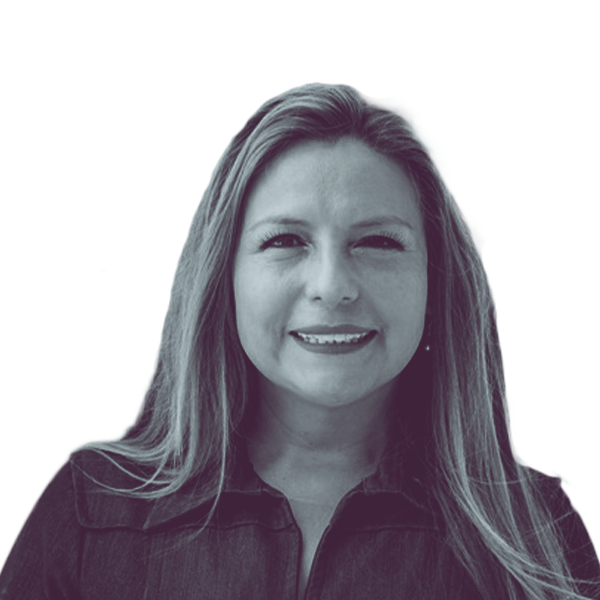 A black and white portrait of Elizabeth Guzman, Democratic candidate for Virginia House District 22, smiling and looking into the camera.