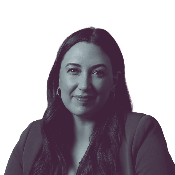 A black and white portrait of Catelin Drey, Democratic candidate for Iowa Senate District 1, smiling and looking into the camera.