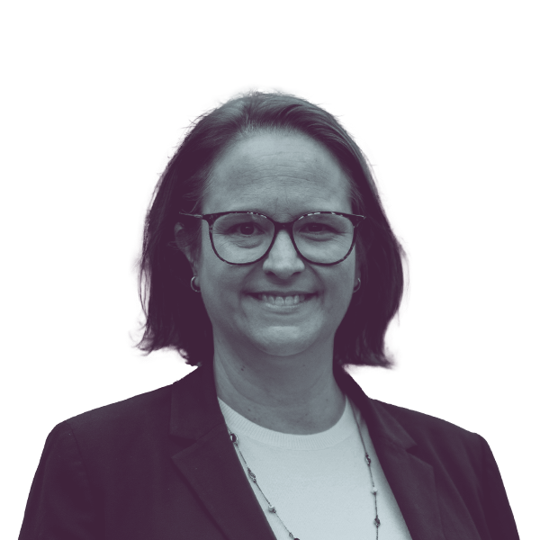 A black and white portrait of Andrea Katz, candidate for New Jersey Assembly District 8, smiling and looking into the camera.