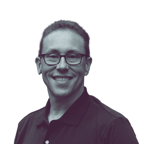 A black and white portrait of Chris Tully, candidate for New Jersey Assembly District 38, smiling and looking into the camera.