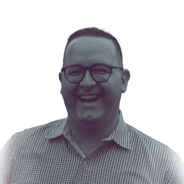 A black and white portrait of Cody Miller, candidate for New Jersey Assembly District 4, smiling and looking into the camera.